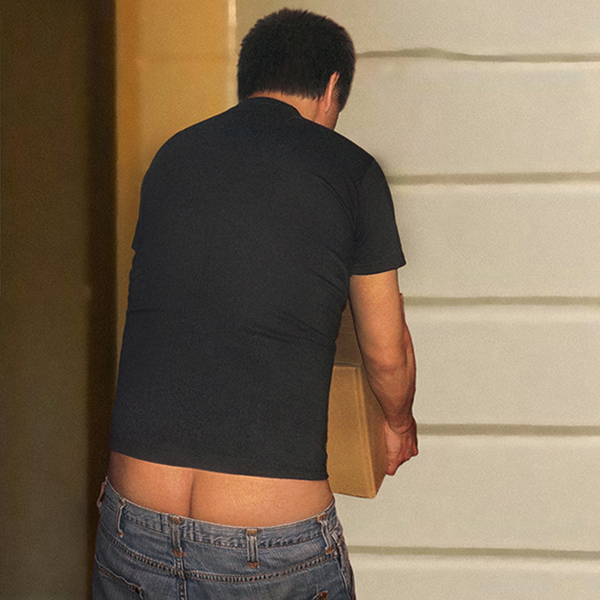 Bip with his pants sagging and buttcrack exposed carrying a box.